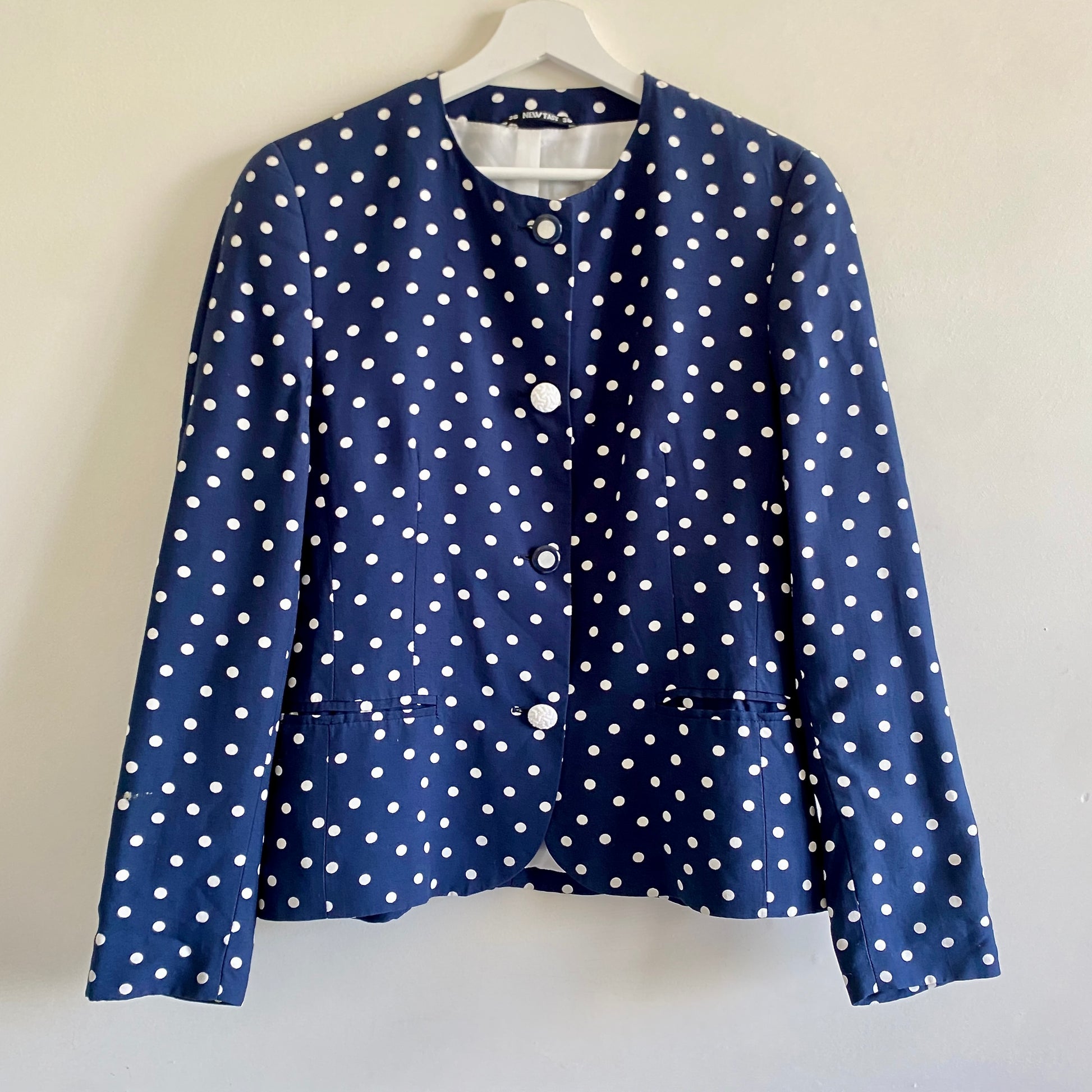 80s vintage navy spotted jacket By New Fast at C&A Round neckline Button front fastening with decorative mismatched  buttons Two pockets to front Fully lined 100% Viscose with Polyester lining Machine washable
