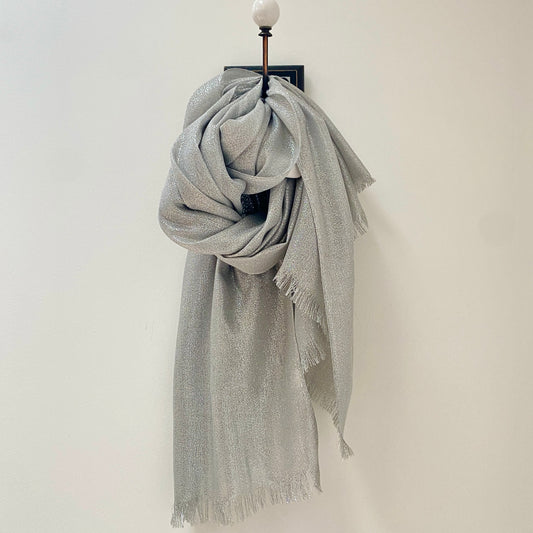      Large Silver Lurex shimmer Scarf/Shawl     Perfect for day or night     Rectangular shape     Frayed edging to ends     Measures 78" long x 40" wide     90% Viscose 10% Polyester      Also available in Light Gold