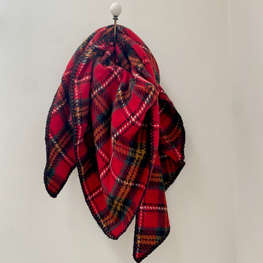 RED TARTAN SCARF WOMENS SCARVES      Red tartan pattern thick scarf     Triangular shaped      Blanket stitched edge detail in Navy     Super soft feel     80% Acrylic 20% Wool     Measures 37" (at longest width point) x 37" (at honest depth point)     Also available in Navy