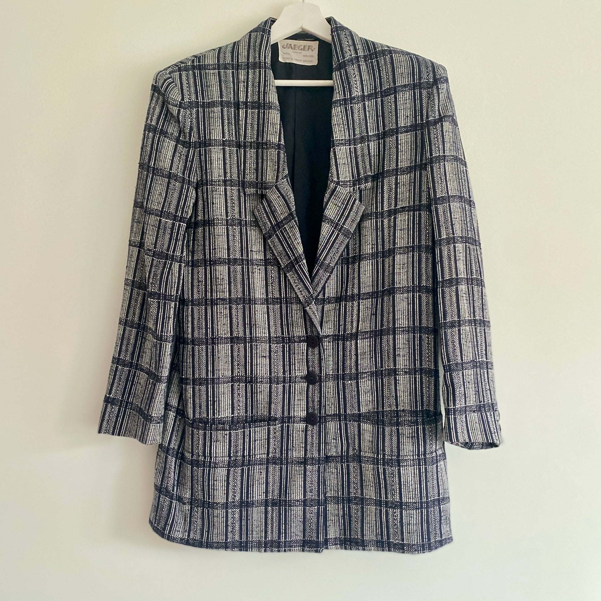 Vintage 80s navy check jacket  By Jaeger Low V neckline  Three button front fastening  Two front pockets Three button decoration to cuffs Shoulder pads