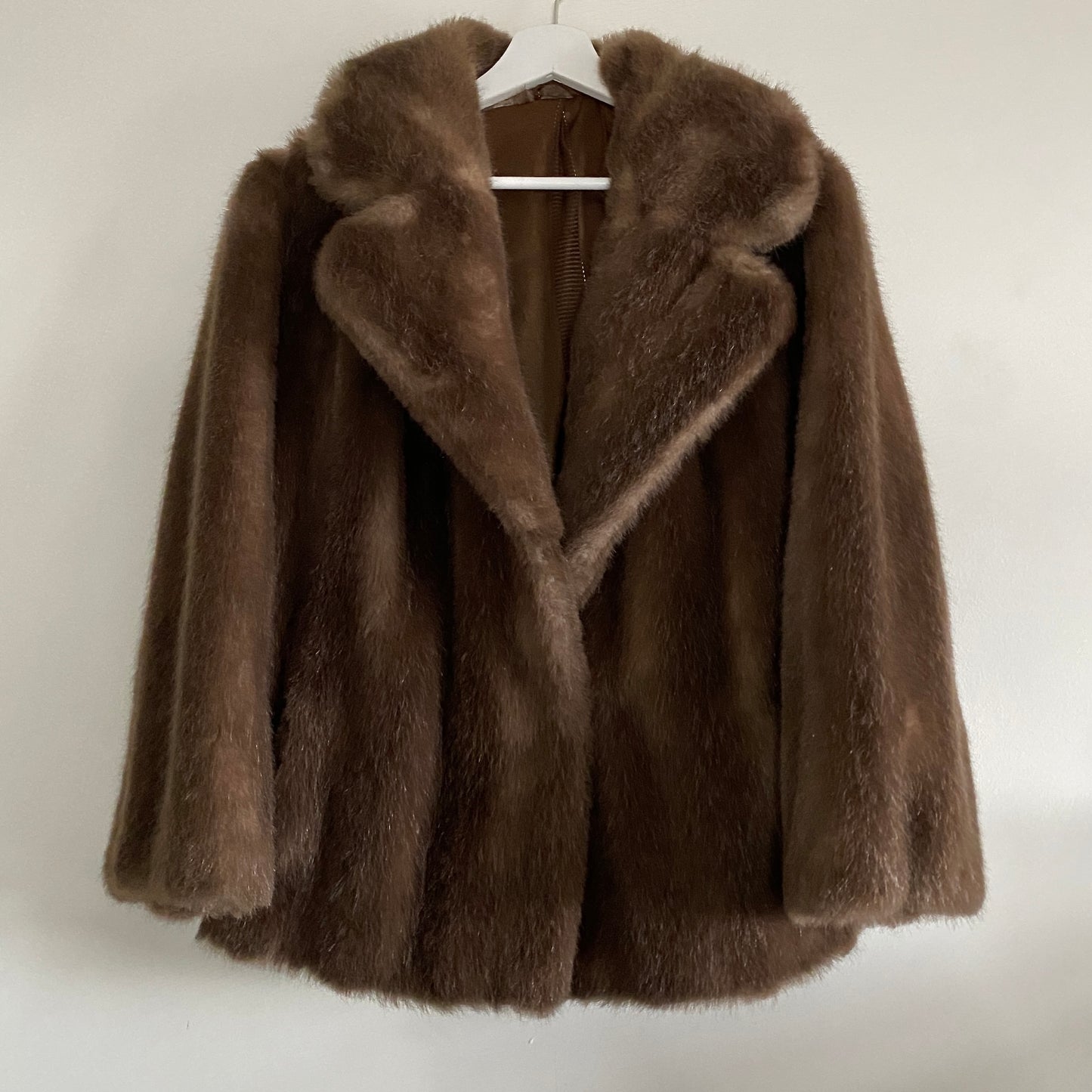 Brown faux fur vintage jacket Rounded revere collar Fastens to front with concealed hook & eye Two front slant pockets Fully lined