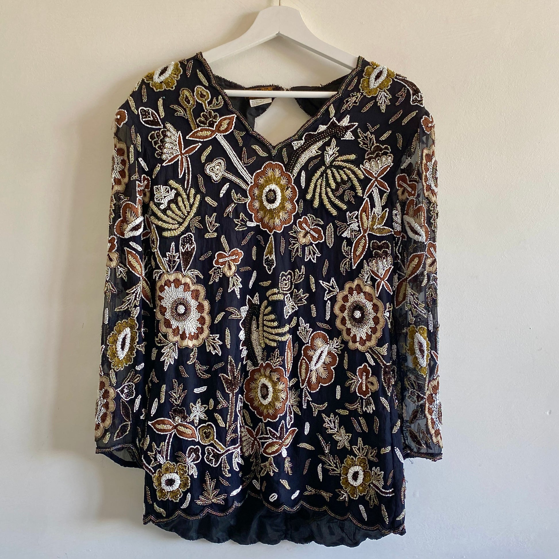 80s heavy beaded vintage silk top By Eve's Allure V neckline Open backed with zip and hook fastening at nape Shoulder pads Body fully lined 100% Silk with polyester lining Vintage size M