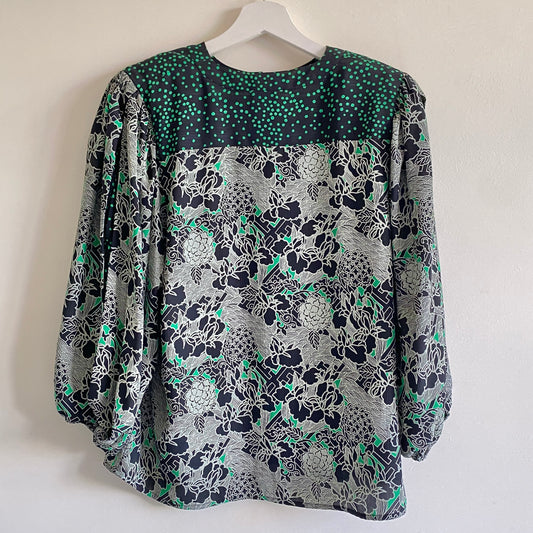 Vintage 80s green and black patterned top  By Diane Freis Round neckline Full balloon sleeves with elasticated cuff Button fastening to nape Shoulder pads