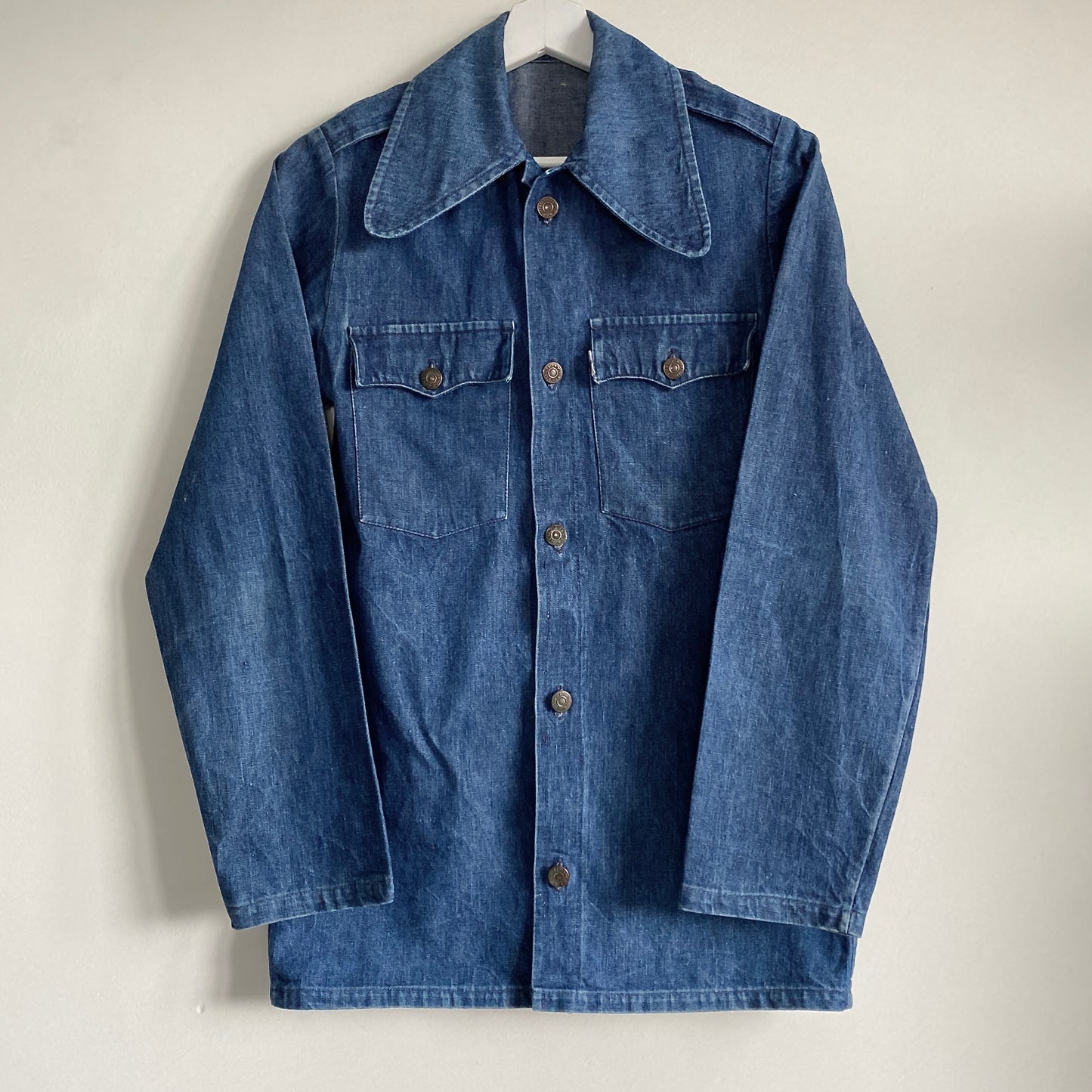 70s vintage Levi's denim shirt Large collars Button down front fastening  Epaulets to shoulders Two front flap pockets Stud details to back yoke Heavy cotton