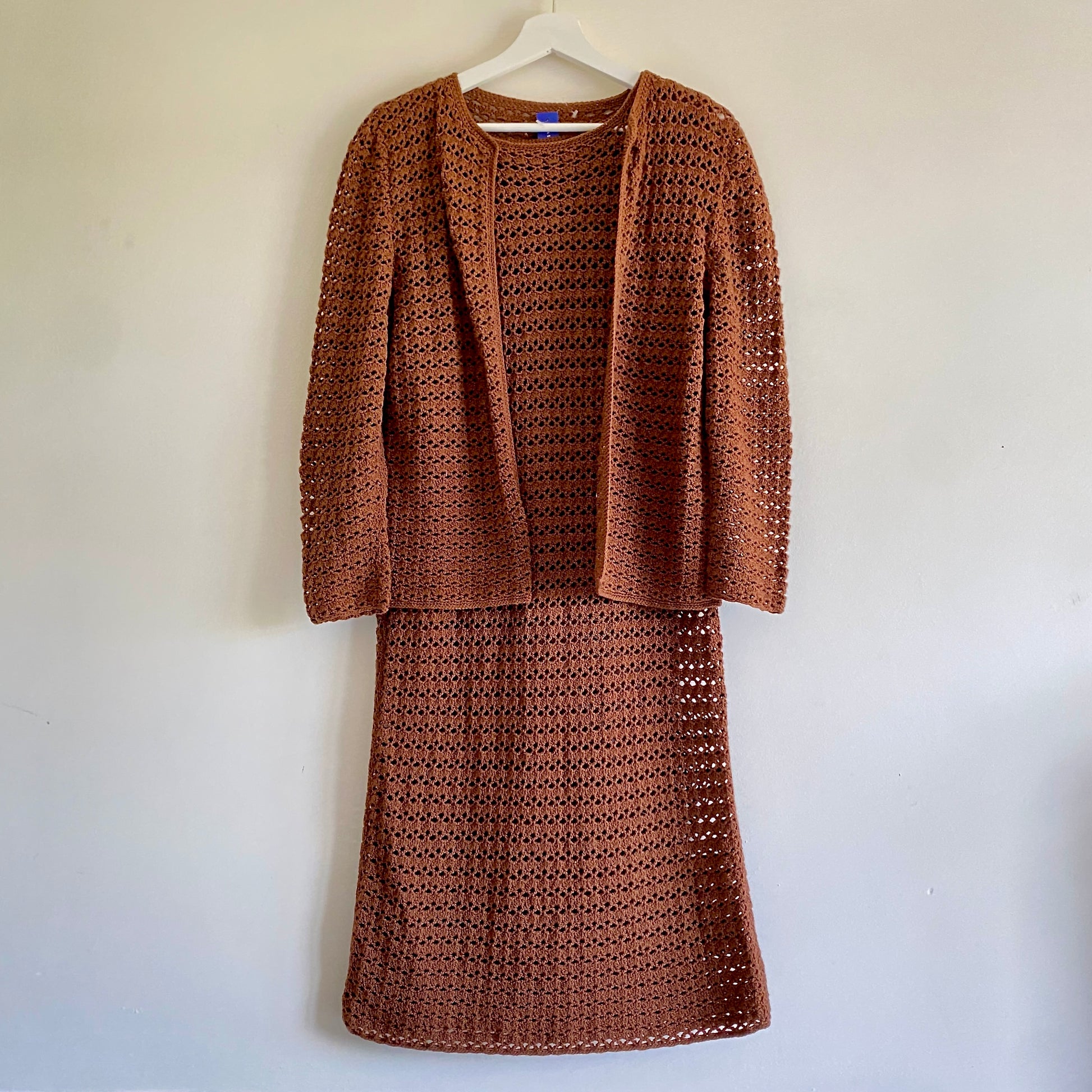 Hand crocheted brown dress suit Absolutely stunning set, we believe to be from the late 60s Shift style sleeveless dress with tie belt Edge to edge long sleeved cardigan/jacket