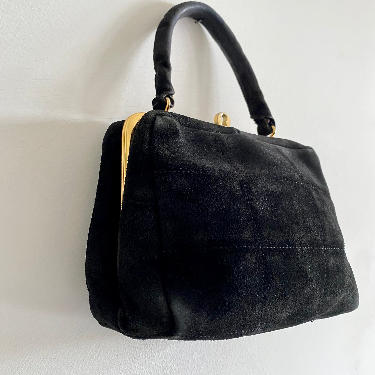 60s vintage black suede box bag By Brandahl Production Stitched square detail to front Clasp fastening to top Handle measures 10.5" Gold hardware Fully lined with inside pocket  Measures 7.5" wide x 6" high x 3" deep
